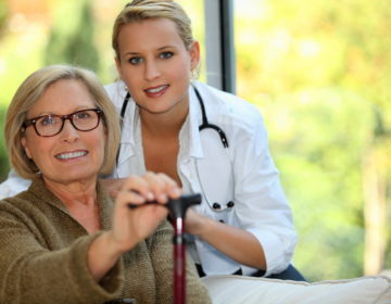 Older woman with a nurse